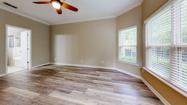 61 Grey Hawk Dr, Saint Augustine, FL 32092 - unfurnished room featuring healthy amount of natural light, a ceiling fan, ornamental molding, and light wood-style floors