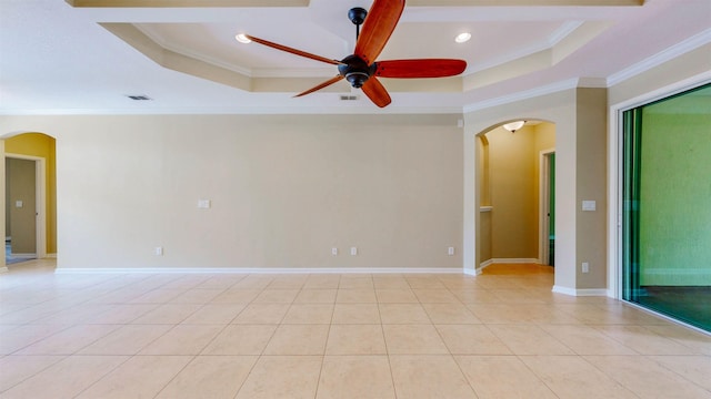 61 Grey Hawk Dr, Saint Augustine, FL 32092 - spare room featuring arched walkways, a raised ceiling, ornamental molding, ceiling fan, and recessed lighting