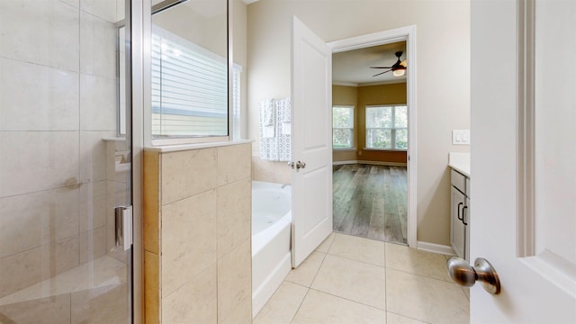 61 Grey Hawk Dr, Saint Augustine, FL 32092 - full bath with vanity, a garden tub, ceiling fan, tile patterned floors, and a shower stall
