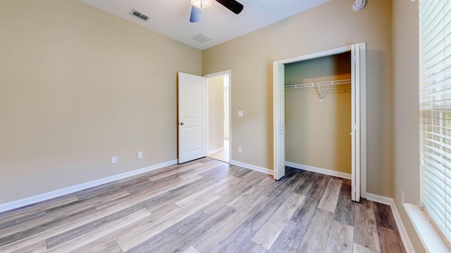 61 Grey Hawk Dr, Saint Augustine, FL 32092 - unfurnished bedroom with light wood-style flooring, a closet, and a ceiling fan