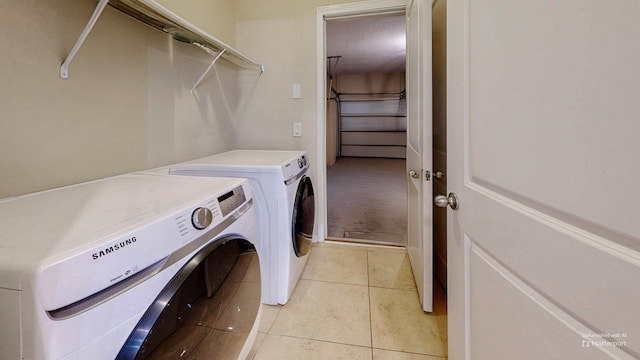 61 Grey Hawk Dr, Saint Augustine, FL 32092 - washroom featuring washer and clothes dryer and light tile patterned flooring