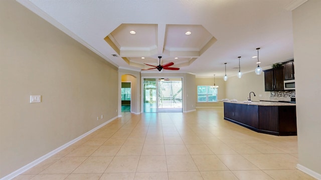 61 Grey Hawk Dr, Saint Augustine, FL 32092 - kitchen featuring crown molding, stainless steel microwave, open floor plan, coffered ceiling, and light countertops