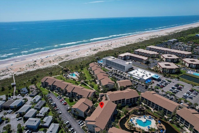 bird's eye view with a beach view and a water view