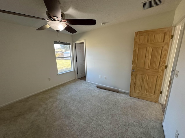 unfurnished bedroom featuring ceiling fan and light colored carpet