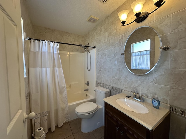 full bathroom featuring toilet, tile walls, tile patterned floors, and shower / bath combination with curtain