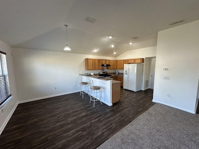 kitchen with kitchen peninsula, dark hardwood / wood-style floors, decorative light fixtures, stainless steel electric stove, and white fridge with ice dispenser