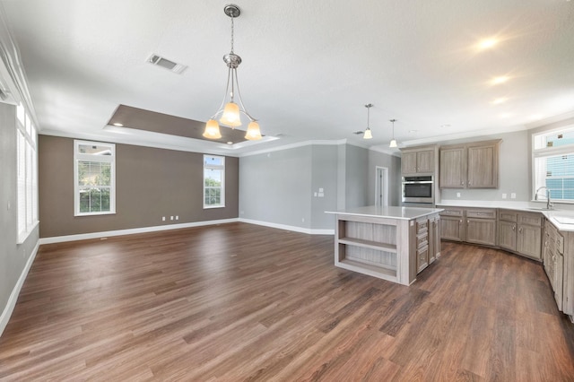 kitchen featuring pendant lighting, stainless steel oven, dark wood-type flooring, and plenty of natural light