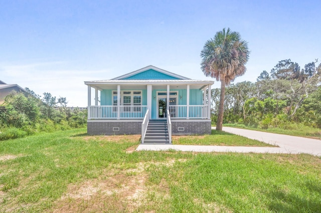 bungalow-style house with a front yard and a porch