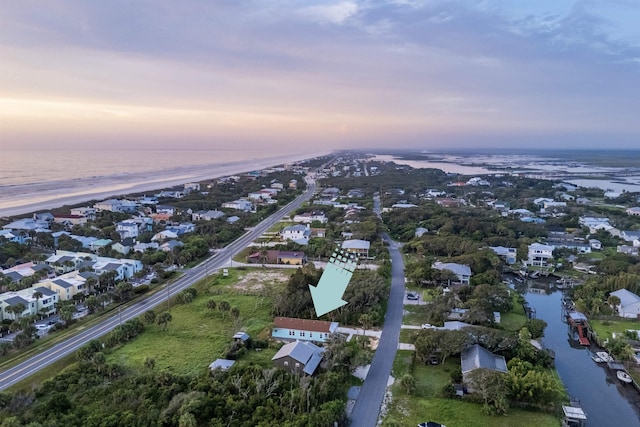 aerial view at dusk with a water view