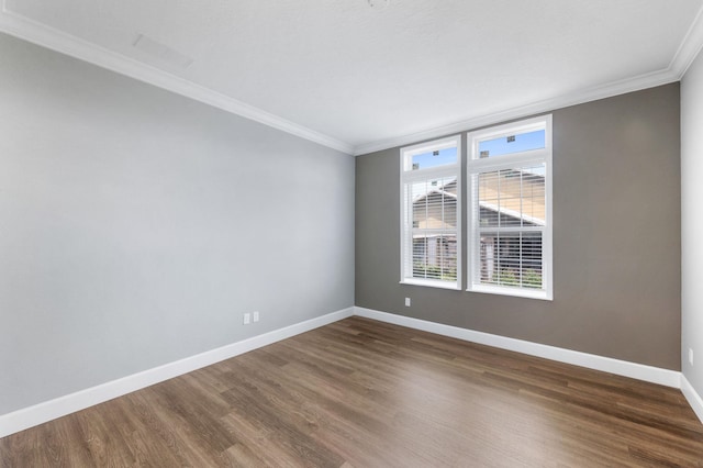 unfurnished room with dark hardwood / wood-style floors and ornamental molding