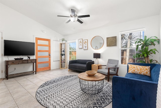 living room with light tile patterned flooring, ceiling fan, and lofted ceiling