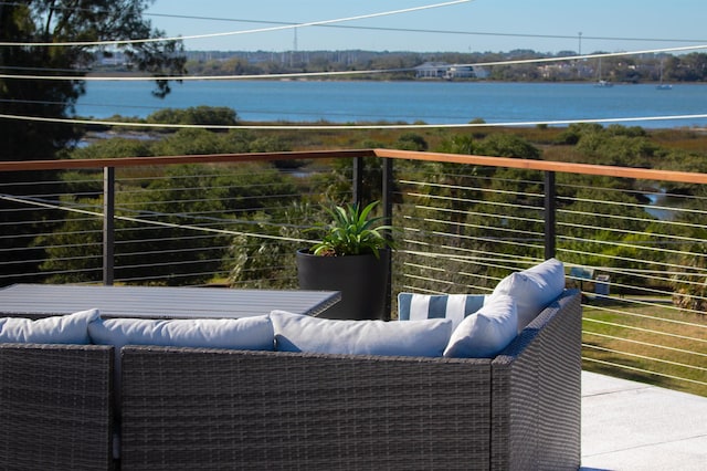 balcony featuring a water view