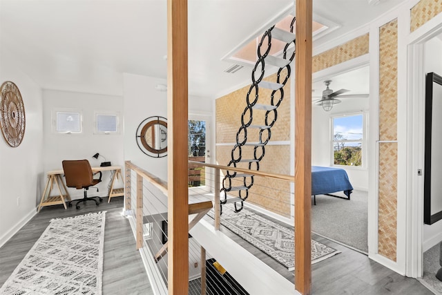 hallway with wood-type flooring