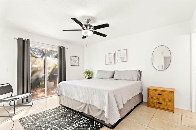 tiled bedroom featuring access to outside and ceiling fan