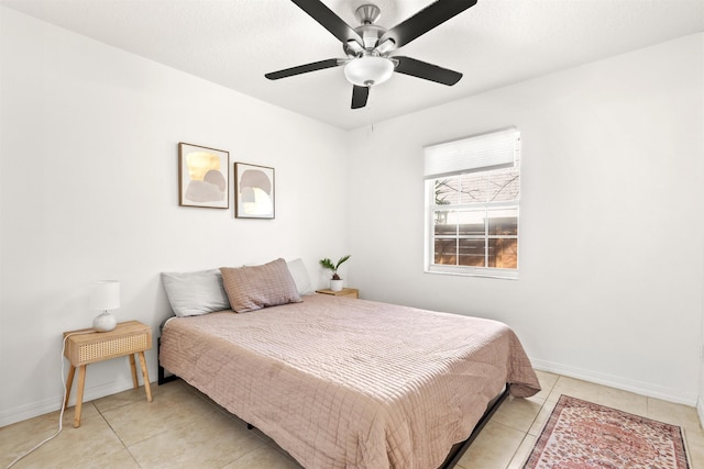 bedroom featuring light tile patterned flooring and ceiling fan