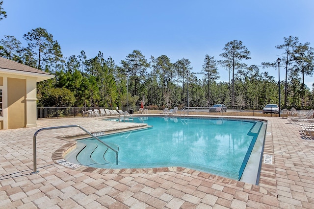 view of pool featuring a patio