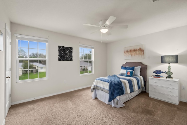 carpeted bedroom with ceiling fan