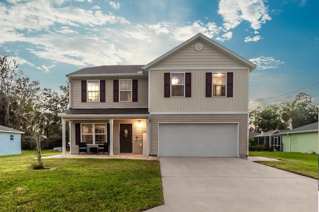 view of front of home featuring a garage and a front lawn