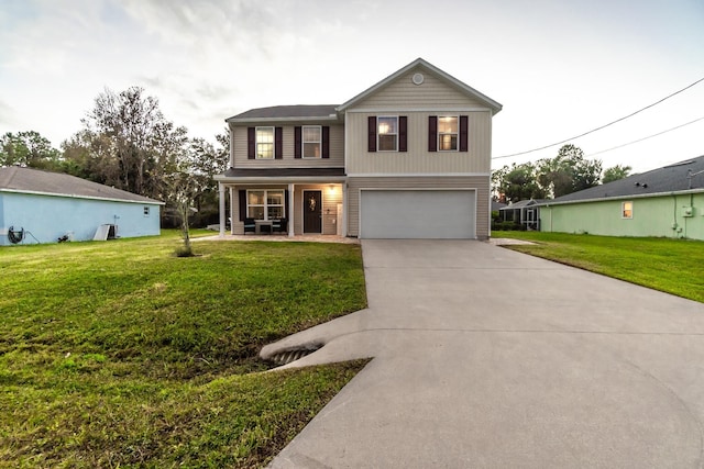 front of property with a front lawn, a porch, and a garage