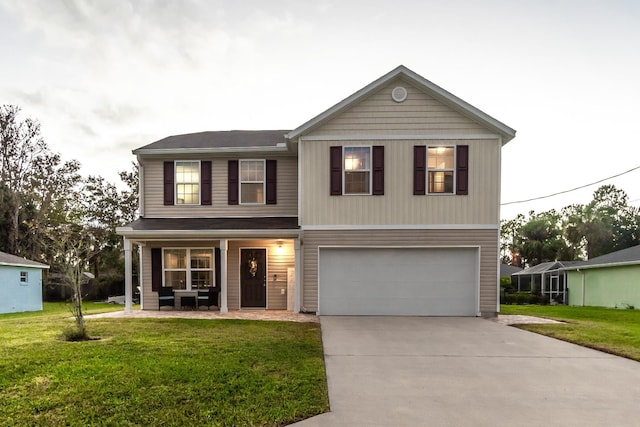 view of front of house featuring a front yard and a garage