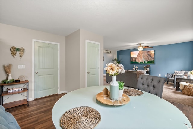 dining area featuring dark hardwood / wood-style flooring and ceiling fan