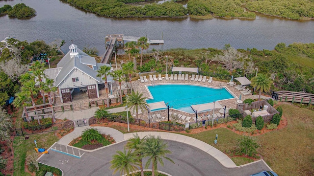 view of swimming pool with a water view