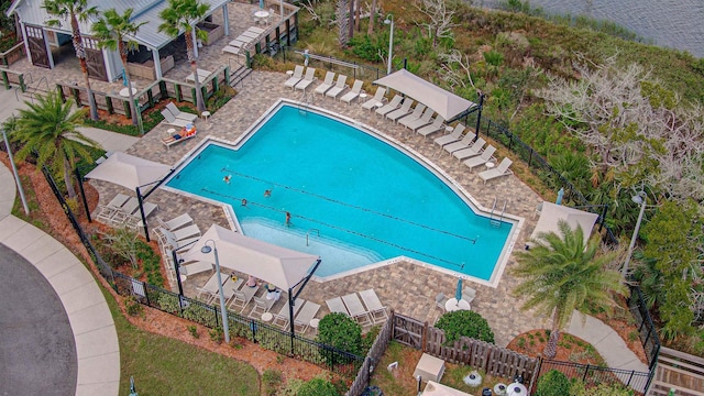 view of pool with a water view