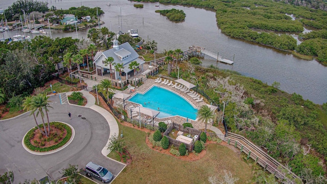 birds eye view of property with a water view