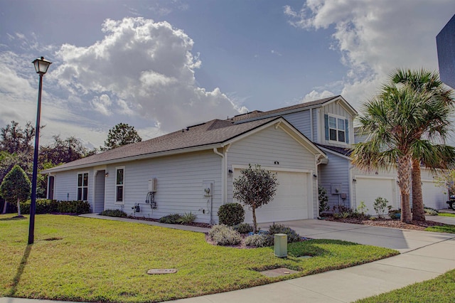 view of front facade with a garage and a front lawn