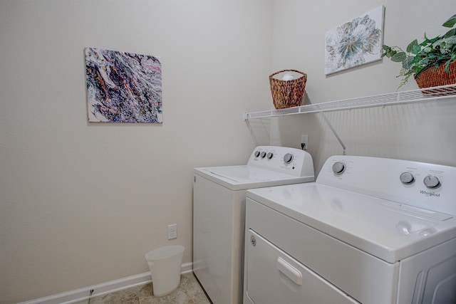 washroom featuring washing machine and clothes dryer