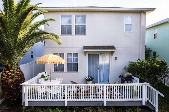 105 Serenity Bay Blvd, Saint Augustine Beach, FL 32080 - rear view of property with outdoor dining area, a deck, and stucco siding