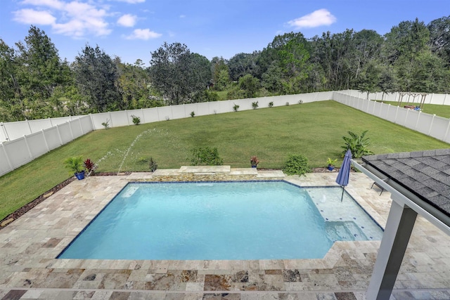 view of pool featuring a yard and a patio