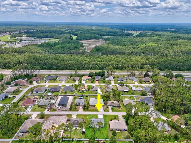 10 Reine Pl, Palm Coast, FL 32164 - aerial view of property and surrounding area with a forest and nearby suburban area