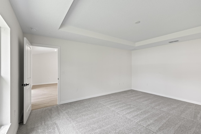 10 Reine Pl, Palm Coast, FL 32164 - carpeted spare room featuring a tray ceiling, baseboards, and a smoke detector