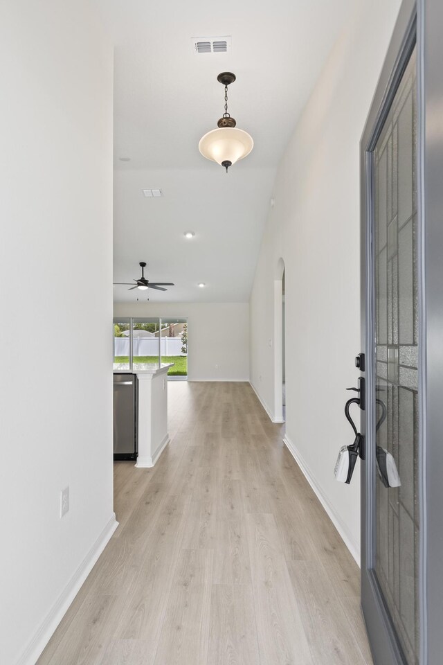 10 Reine Pl, Palm Coast, FL 32164 - corridor with vaulted ceiling, light wood-style flooring, and baseboards