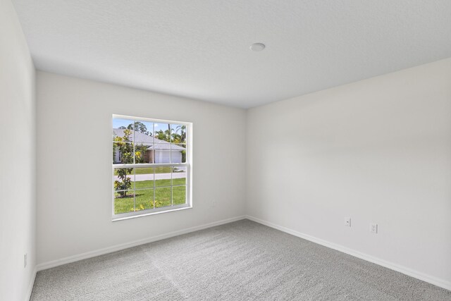 10 Reine Pl, Palm Coast, FL 32164 - carpeted spare room with baseboards