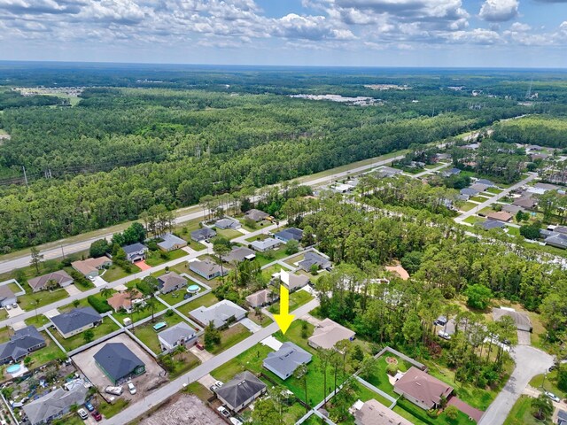 10 Reine Pl, Palm Coast, FL 32164 - view of property location featuring a forest and nearby suburban area