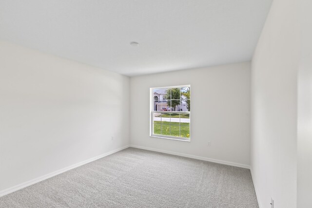 10 Reine Pl, Palm Coast, FL 32164 - spare room with carpet and baseboards