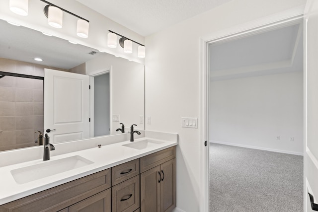 10 Reine Pl, Palm Coast, FL 32164 - bathroom featuring double vanity, baseboards, and a shower