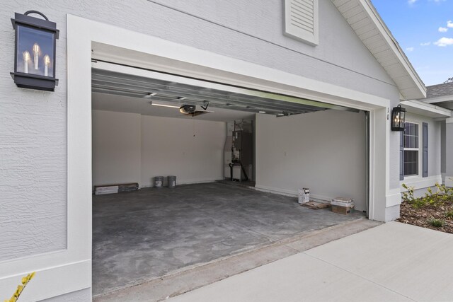 10 Reine Pl, Palm Coast, FL 32164 - garage featuring a garage door opener and driveway