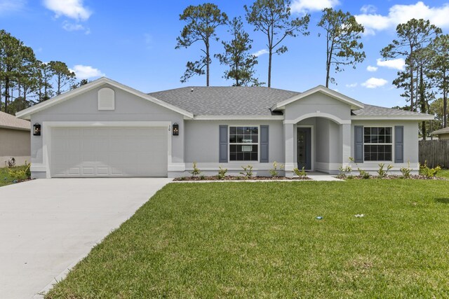 10 Reine Pl, Palm Coast, FL 32164 - ranch-style house featuring a garage, driveway, roof with shingles, and stucco siding