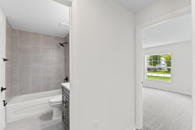 10 Reine Pl, Palm Coast, FL 32164 - bathroom with vanity, shower / tub combination, toilet, tile patterned flooring, and baseboards