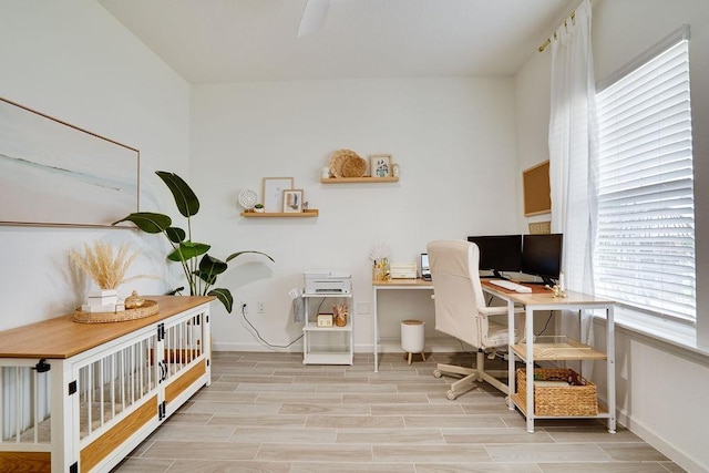 office area with light hardwood / wood-style floors