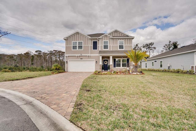 view of front facade with a front yard and a garage