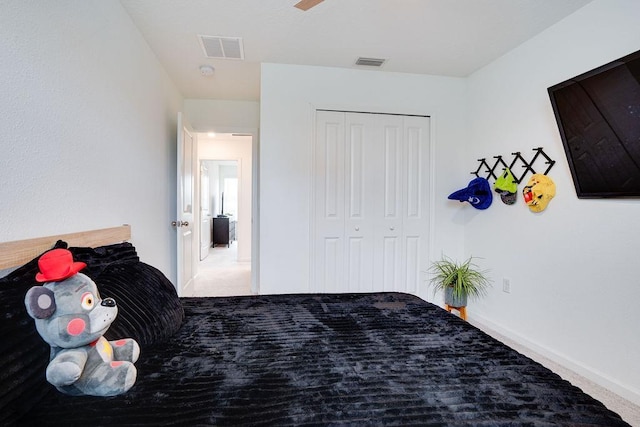 carpeted bedroom featuring a closet