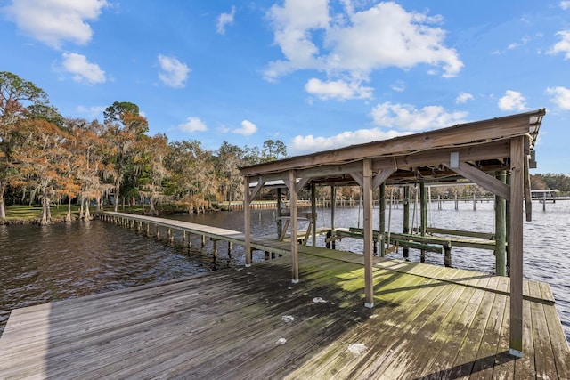 view of dock featuring a water view and boat lift