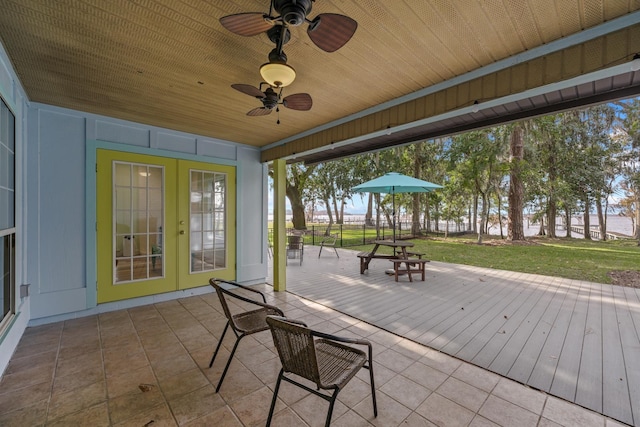 view of patio / terrace with french doors, ceiling fan, and fence