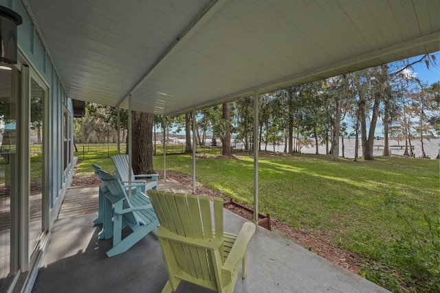 view of patio with a water view