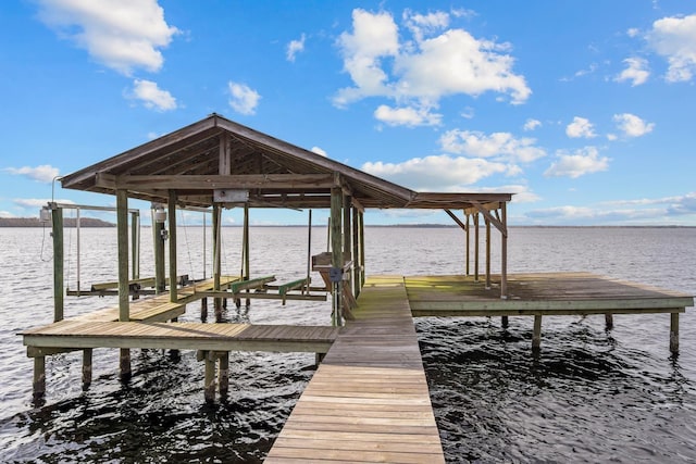 dock area featuring a water view and boat lift