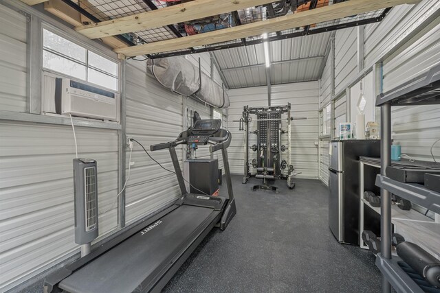 exercise room featuring metal wall and cooling unit